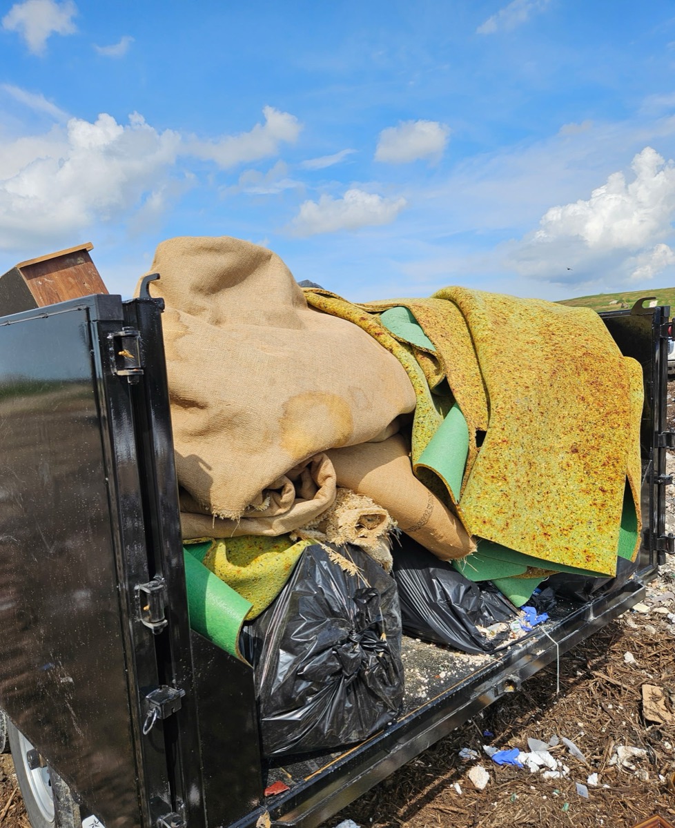 Carpet and pad tear-out at the landfill