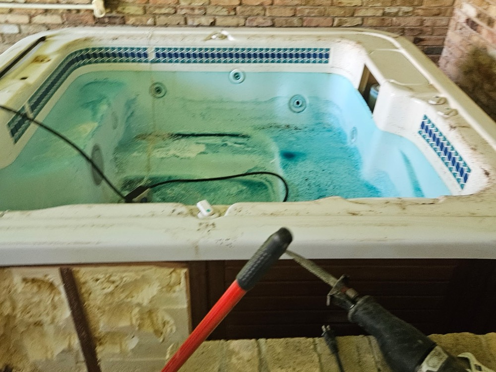 Hot tub being cut apart for removal